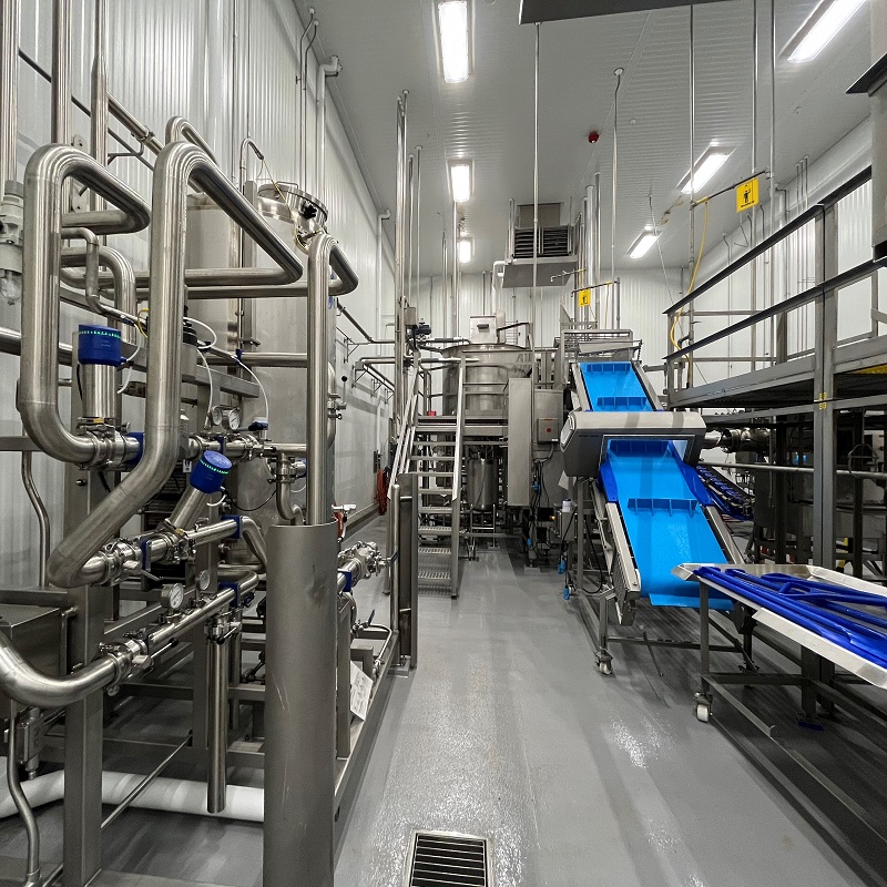 The inside of food product factory with of stainless steel equipment.